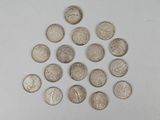 a lot of coins arranged in a circle on a white surface