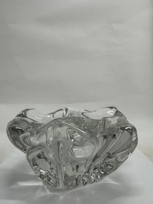 a glass bowl that is sitting on a white surface
