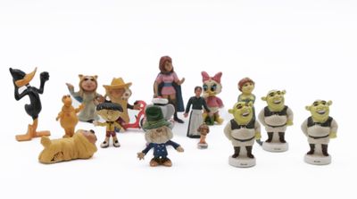 many figurines of different characters on a white surface