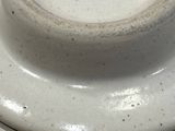 a white plate with a black and white design on it