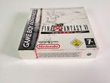 the box for the game final fantasy iv is sitting on a white surface