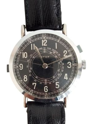 a close up of a wrist watch with a black leather strap