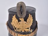 a black and gold hat with a gold eagle on it