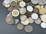 a lot of coins that are on the table