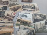 a lot of old postcards sitting on a table