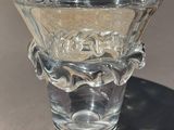 a glass vase that is sitting on a table