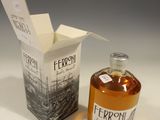 a bottle of ferroli next to a box of wine