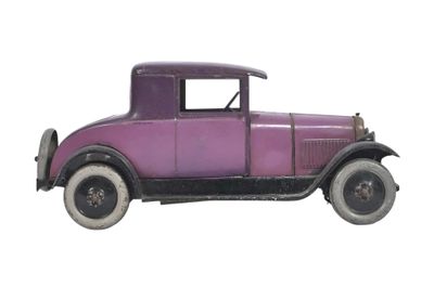 an old purple car is sitting on a white surface with a white background