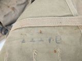 a close up of a military bag with a tag on it