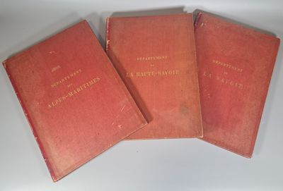 three red books sitting on top of a white table