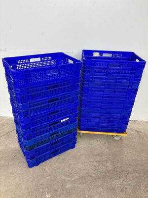 two blue plastic crates stacked on top of each other