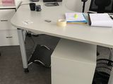 a white desk with a computer on top of it