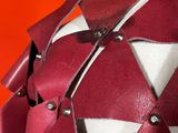 a close up of a red and white helmet on a mannequin mannequin