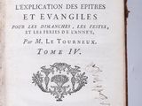 an old book with writing on it sitting on top of a table