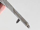 a person holding a pair of scissors in their hand