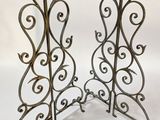 pair of antique wrought iron candle holders with scroll designs