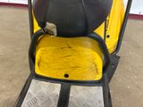 a yellow and black scooter parked in a garage