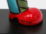 a colorful shoe that is on top of a stand