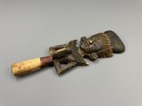 a close up of a wooden object on a table with a baseball bat