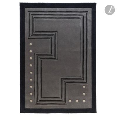 a black and gray rug with a square design on it