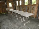 a long table that is in a room with wooden walls