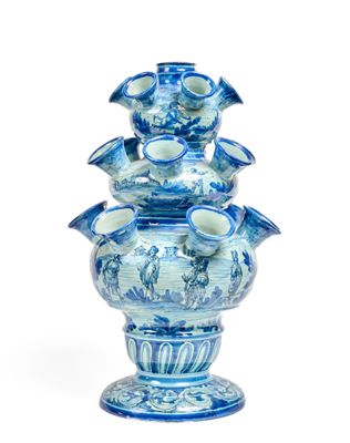 a blue and white vase that has a bunch of blue flowers on it