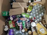 a cardboard box full of food and drinks in it