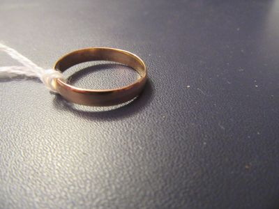 a wedding ring on a table with a string