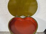 a heart shaped box sitting on the ground