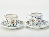 three cups and saucers sitting on top of a white table