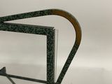 a close up of a glass shelf with a metal frame