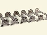 six silver metal door handles on a white background