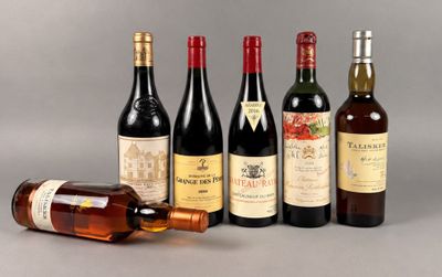 several bottles of wine sitting next to each other on a table