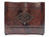 a small wooden box with a decorative design on it