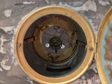 a clock that is sitting on top of a marble table