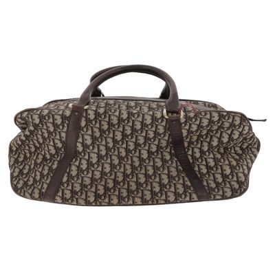a brown and black duffel bag on a white background