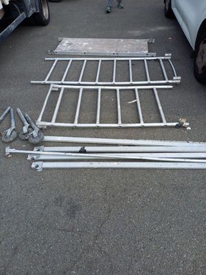 several pieces of metal are laying on the ground in a parking lot