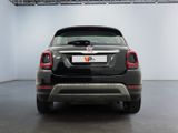 the back end of a black fiat suv parked in a garage