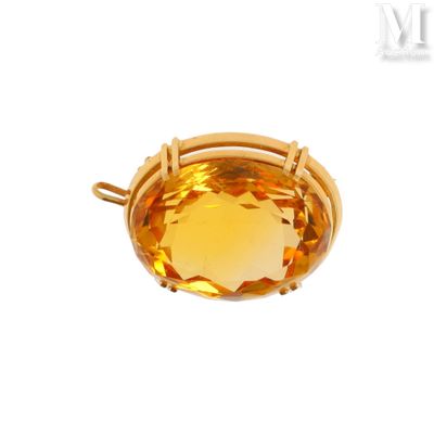 a close up of a yellow topaz stone in a gold plated setting