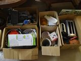 two boxes of electronic equipment sitting on the floor