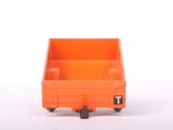 an orange toy truck that is sitting on a white surface