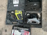 a tool box with a hammer and other tools on the ground