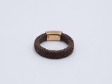 a brown braided bracelet with a gold clasp on a white background