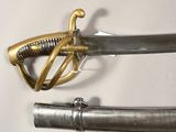 a close up of two swords on a white surface