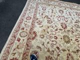 a person standing next to a rug on the floor