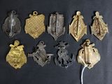 some of the medals are on display on a black surface