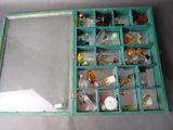 a blue box with a mirror and many bottles in it