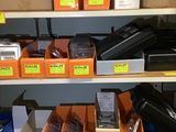 many different types of electronics on the shelves in the store