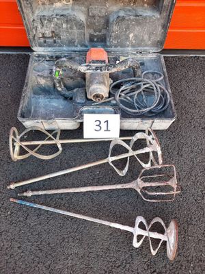 a metal case with tools in it sitting on the floor