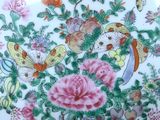 a plate with flowers and birds on it